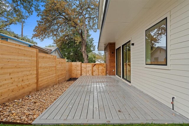 1135 Salina St, Austin, TX 78702 - wooden terrace featuring a fenced backyard
