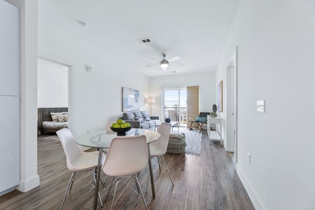 6444 Burnet Rd Unit 308, Austin, TX 78757 - dining room featuring wood finished floors and a ceiling fan