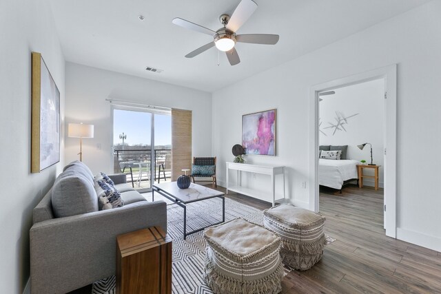 6444 Burnet Rd Unit 308, Austin, TX 78757 - living area with wood finished floors and ceiling fan