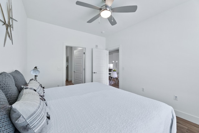 6444 Burnet Rd Unit 308, Austin, TX 78757 - bedroom with dark wood finished floors and a ceiling fan
