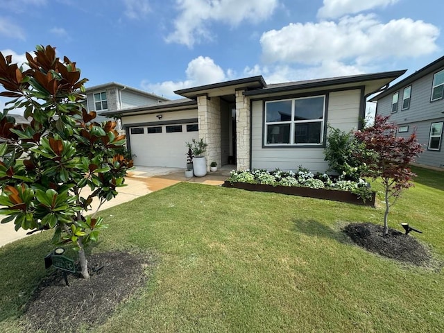 view of front of property with stone siding, concrete driveway, an attached garage, and a front yard