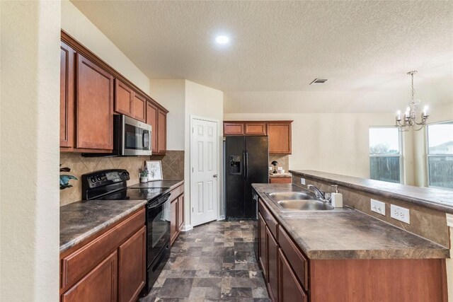 214 Teron Dr, San Marcos, TX 78666 - kitchen with dark countertops, black appliances, visible vents, decorative backsplash, and a sink