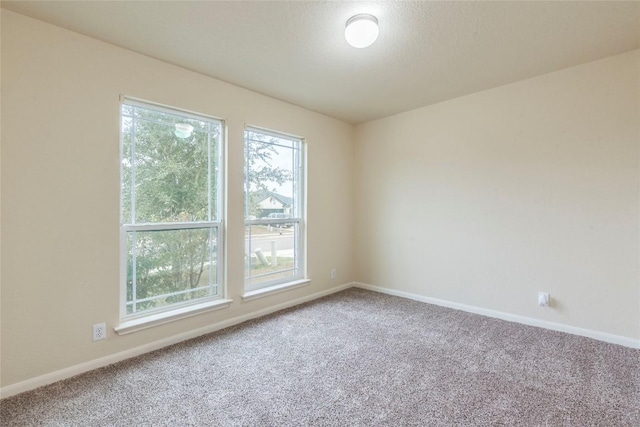 214 Teron Dr, San Marcos, TX 78666 - spare room featuring carpet floors and baseboards
