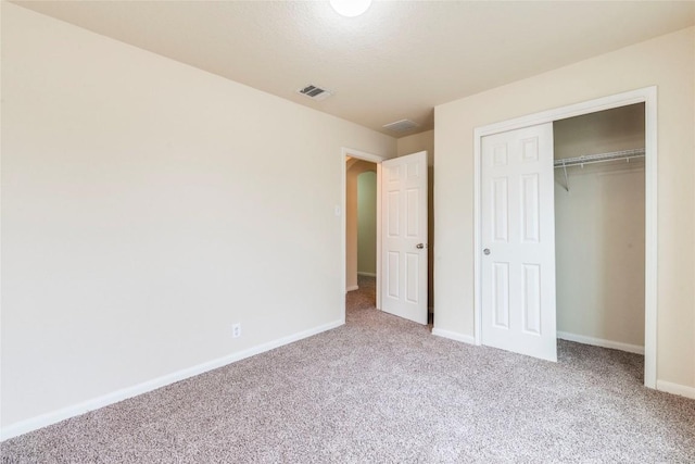 214 Teron Dr, San Marcos, TX 78666 - unfurnished bedroom with a closet, baseboards, visible vents, and carpet floors