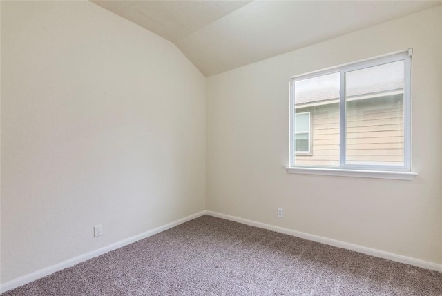 214 Teron Dr, San Marcos, TX 78666 - empty room featuring baseboards, lofted ceiling, and carpet floors