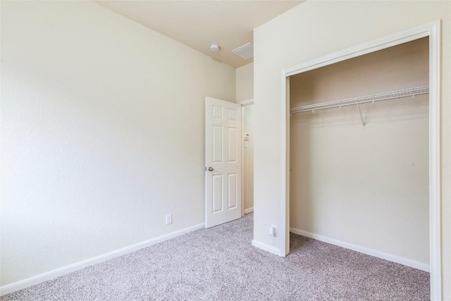 214 Teron Dr, San Marcos, TX 78666 - unfurnished bedroom with a closet, carpet flooring, baseboards, and visible vents