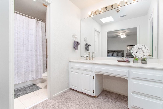 bathroom featuring visible vents, toilet, tile patterned flooring, shower / bathtub combination with curtain, and vanity