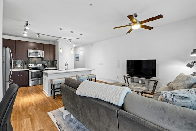 1900 Barton Springs Rd Unit 4040, Austin, TX 78704 - living area featuring light wood-style floors and a ceiling fan