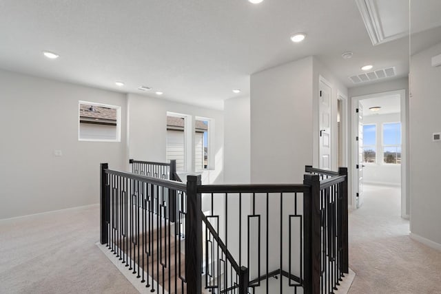 1205 N Roger Hanks Pkwy, Dripping Springs, TX 78620 - hallway with light carpet, an upstairs landing, and attic access