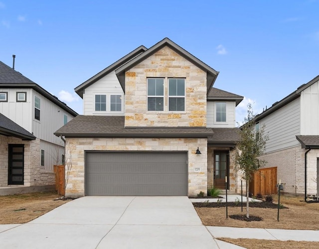 view of front of property featuring an attached garage, fence, concrete driveway, stone siding, and roof with shingles