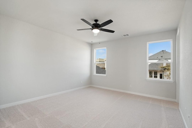1205 N Roger Hanks Pkwy, Dripping Springs, TX 78620 - carpeted spare room featuring a ceiling fan, visible vents, and baseboards
