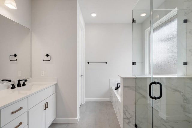 1205 N Roger Hanks Pkwy, Dripping Springs, TX 78620 - bathroom with a stall shower, vanity, tile patterned flooring, baseboards, and a bath