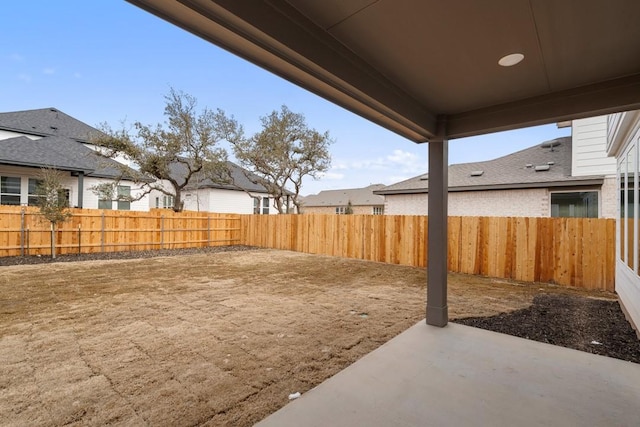 1205 N Roger Hanks Pkwy, Dripping Springs, TX 78620 - view of yard featuring a residential view, a fenced backyard, and a patio