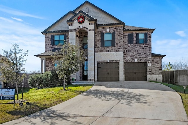 french provincial home with a garage, concrete driveway, brick siding, and fence