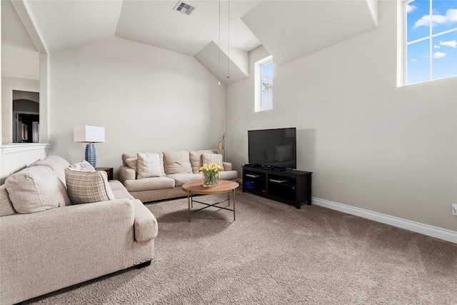 carpeted living area with baseboards, visible vents, and vaulted ceiling