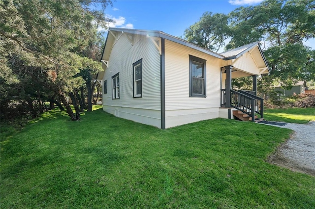 view of property exterior with a lawn