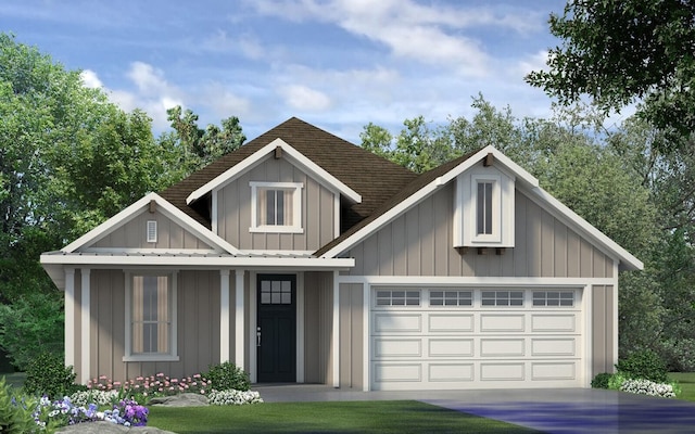 view of front of house with board and batten siding, roof with shingles, driveway, and a garage