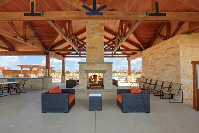 216 Crescent Heights Dr, Georgetown, TX 78628 - view of patio / terrace with a gazebo, an outdoor bar, and a multi sided fireplace