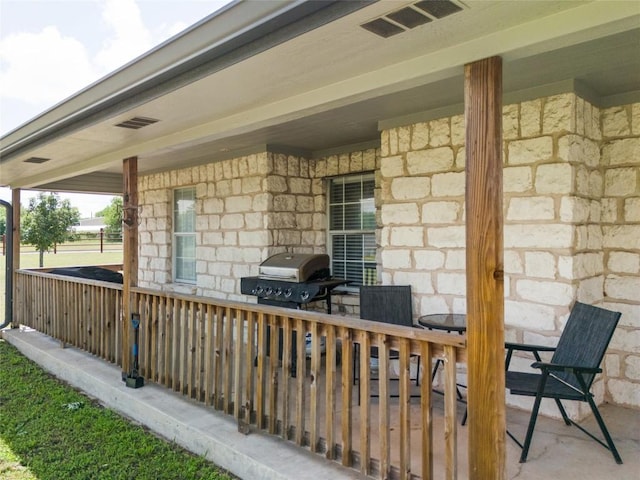 view of patio / terrace featuring area for grilling and visible vents