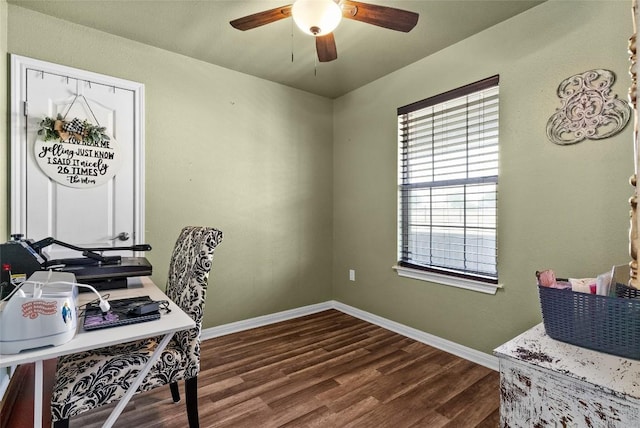 office with dark wood-style floors, a ceiling fan, and baseboards