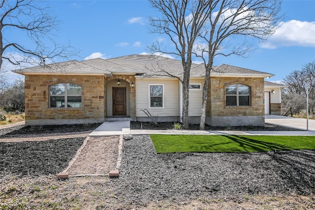 139 W Maple Dr, Marble Falls, TX 78654 - view of front of property with stone siding and a garage