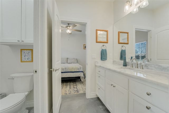 139 W Maple Dr, Marble Falls, TX 78654 - bathroom with vanity, finished concrete floors, ensuite bathroom, toilet, and a ceiling fan