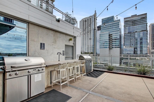 222 W Ave Unit 2403, Austin, TX 78701 - view of patio / terrace with a grill and a city view