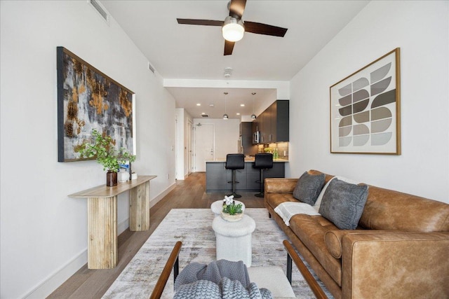 222 W Ave Unit 2403, Austin, TX 78701 - living room with ceiling fan, dark wood-type flooring, and recessed lighting