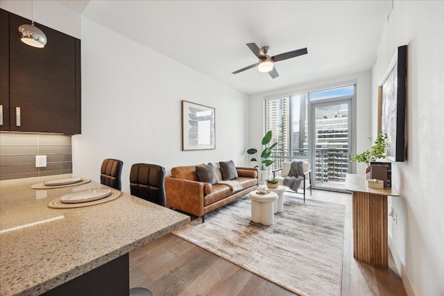 222 W Ave Unit 2403, Austin, TX 78701 - living area with light wood-style floors and a ceiling fan