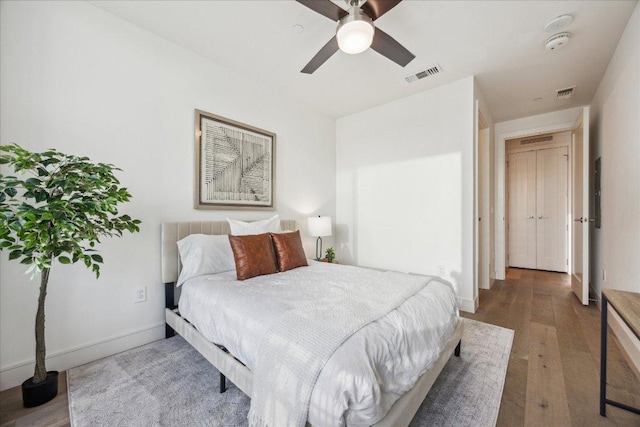 222 W Ave Unit 2403, Austin, TX 78701 - bedroom with wood finished floors and ceiling fan