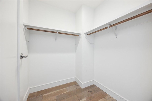 222 W Ave Unit 2403, Austin, TX 78701 - spacious closet with wood finished floors