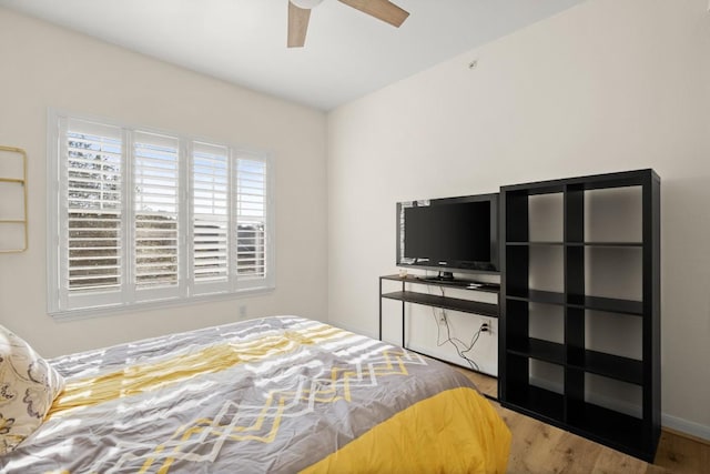 bedroom featuring ceiling fan and light wood finished floors