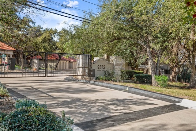 view of gate with fence