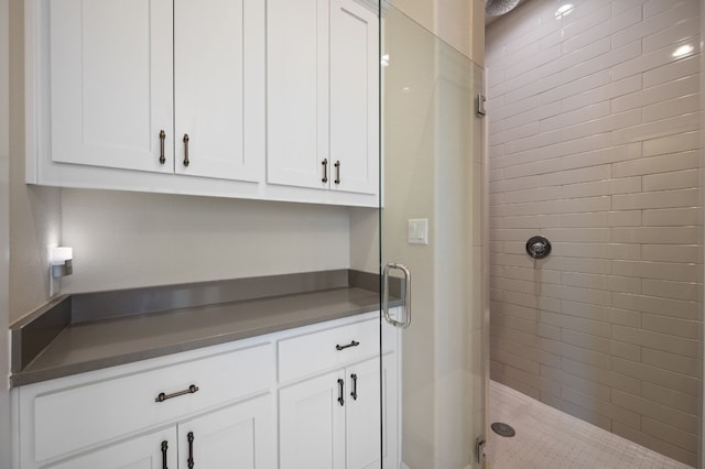 bathroom featuring a stall shower