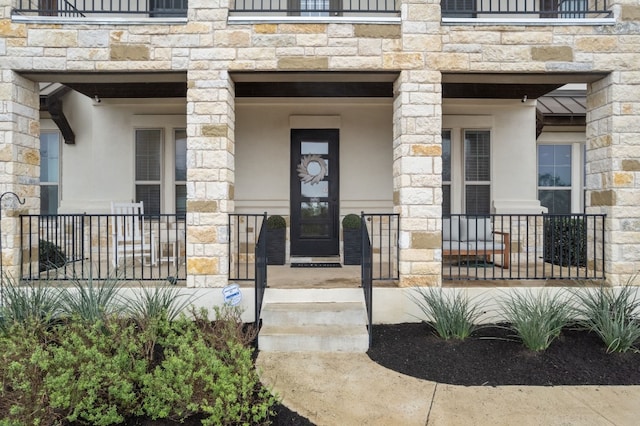 entrance to property with stone siding