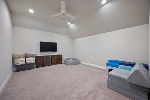 sitting room featuring lofted ceiling, carpet floors, a ceiling fan, and baseboards