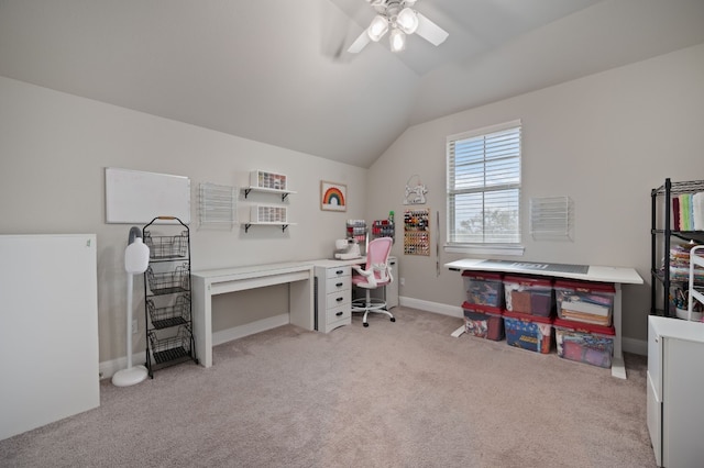 office area featuring lofted ceiling, baseboards, a ceiling fan, and light colored carpet