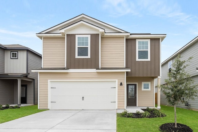 view of front facade featuring a garage, a front yard, driveway, and board and batten siding