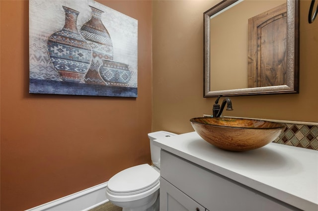 bathroom with toilet and vanity
