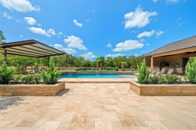 pool featuring a patio area
