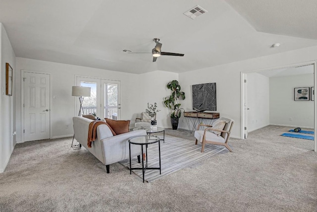 living room with light carpet, baseboards, visible vents, and a ceiling fan