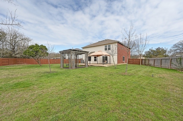 back of house featuring a fenced backyard, a lawn, a gazebo, and a pergola