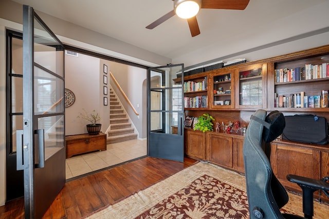 office area with ceiling fan and light wood finished floors