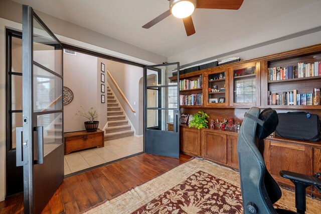 605 Hickory Run Dr, Cedar Park, TX 78613 - home office with wood finished floors, ceiling fan, and built in desk
