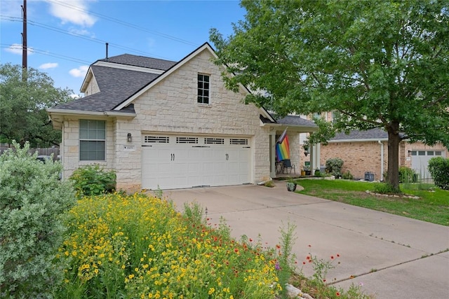 605 Hickory Run Dr, Cedar Park, TX 78613 - traditional-style house featuring roof with shingles, driveway, stone siding, and a garage