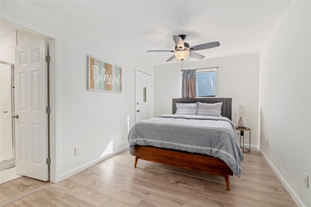 bedroom with baseboards, a ceiling fan, and light wood-style flooring