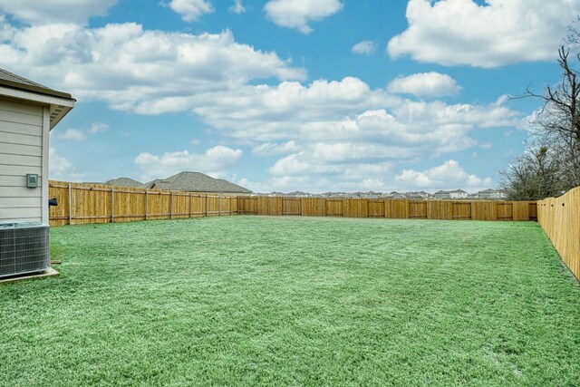 13029 Field Plow Ln, Elgin, TX 78621 - view of yard with central air condition unit