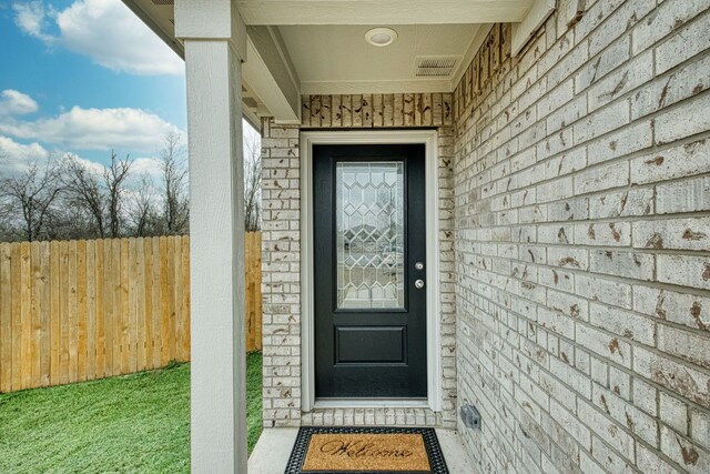 13029 Field Plow Ln, Elgin, TX 78621 - view of exterior entry featuring brick siding