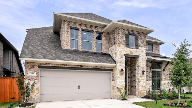 702 Bay Breeze Dr, Kyle, TX 78640 - view of front facade featuring concrete driveway, a garage, and roof with shingles
