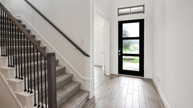 702 Bay Breeze Dr, Kyle, TX 78640 - entrance foyer featuring stairway and wood finished floors